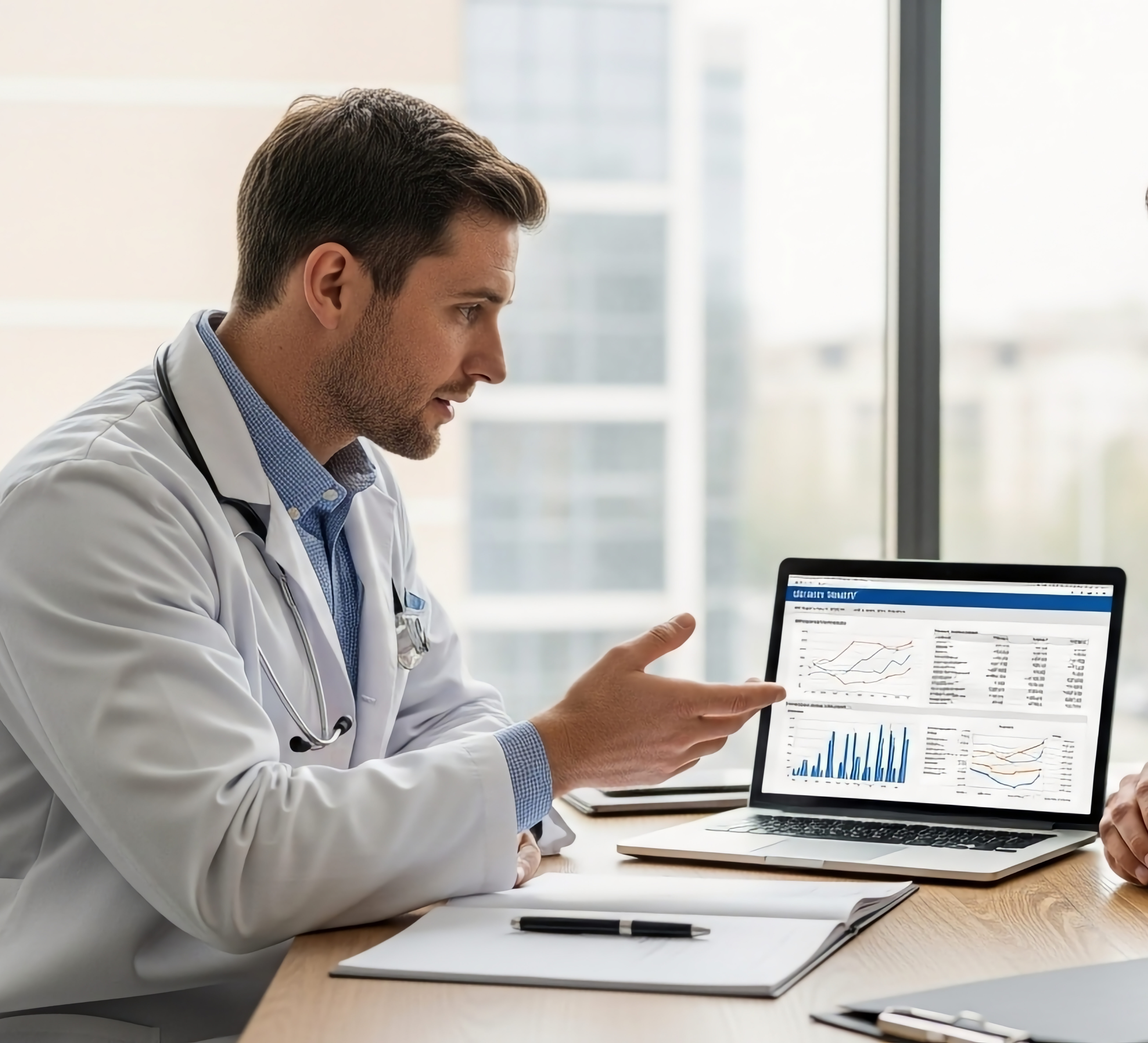 Healthcare leaders reviewing performance data together at a workstation