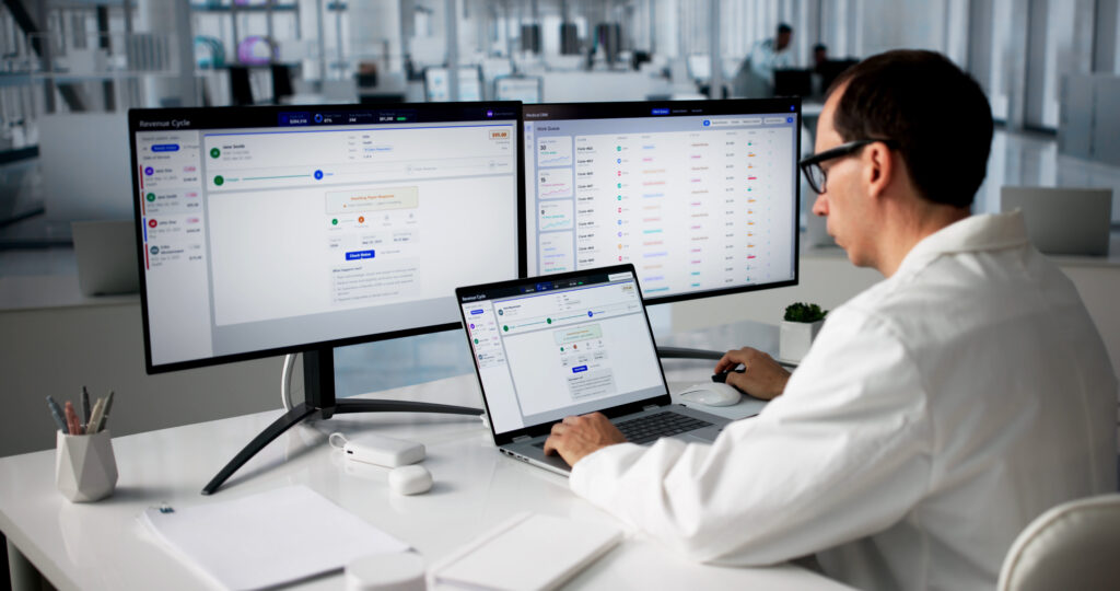 Clinician reviewing electronic health record workflows and documentation on multiple screens